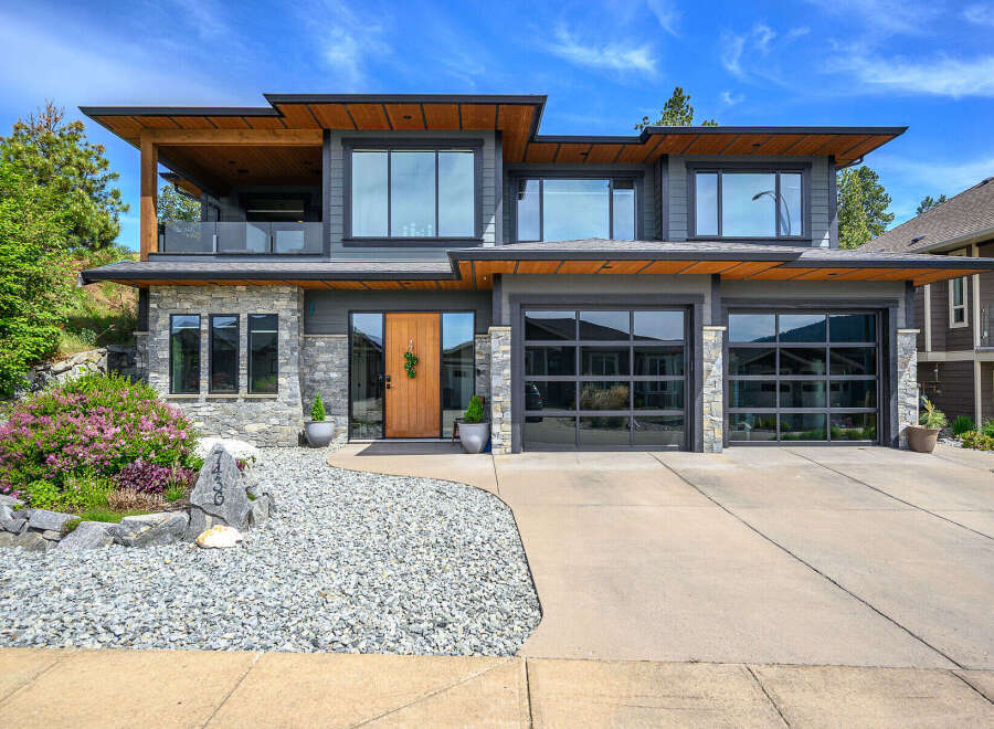 This stunning modern home boasts a sleek design with a beautiful facade.