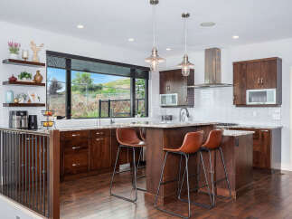 Step into this stunning kitchen, boasting rich wood cabinetry and a spacious island perfect for entertaining.