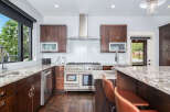 This stunning kitchen boasts a modern design with high-end appliances and exquisite finishes.