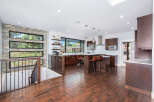 This stunning kitchen boasts a modern design with sleek cabinetry and a spacious island, perfect for entertaining.