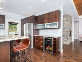 This stunning kitchen boasts modern cabinetry, stainless steel appliances, and a sleek countertop, perfect for culinary enthusiasts.