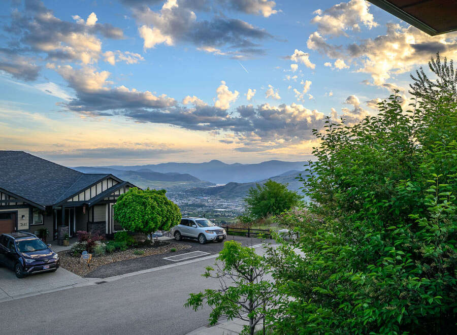 This stunning property offers breathtaking views of the surrounding mountains and valley.