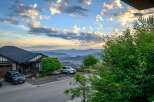 This stunning property offers breathtaking views of the surrounding mountains and valley.
