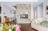 This stunning property boasts a beautiful stone fireplace, creating a warm and inviting atmosphere.