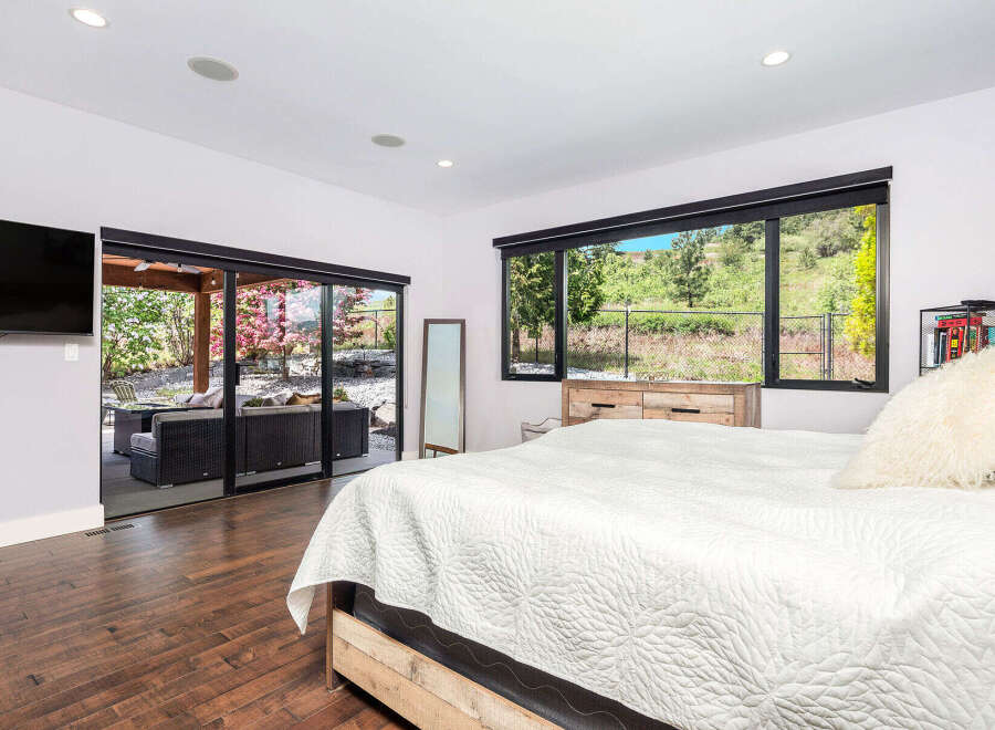This stunning bedroom boasts a seamless blend of indoor and outdoor living.