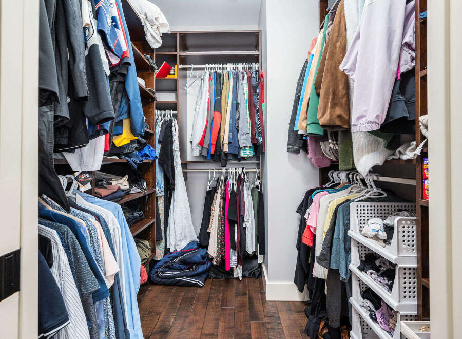 Step into organized luxury with this stunning walk-in closet! Featuring ample storage space and stylish design, this closet is perfect for keeping your wardrobe tidy and accessible.