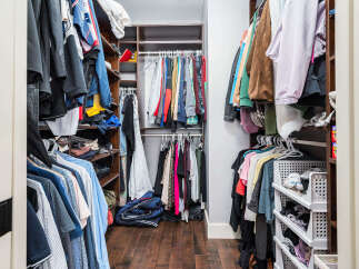 Step into organized luxury with this stunning walk-in closet! Featuring ample storage space and stylish design, this closet is perfect for keeping your wardrobe tidy and accessible.