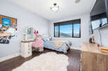 This charming bedroom offers a cozy and inviting atmosphere, perfect for relaxation.