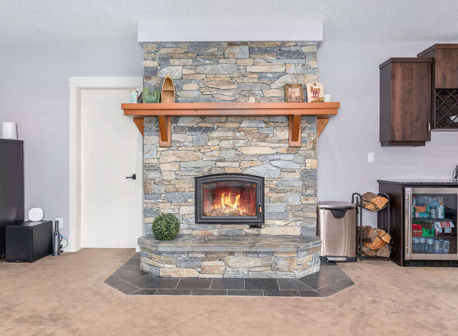 This stunning property boasts a beautiful stone fireplace, perfect for cozy evenings.
