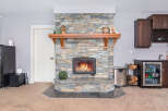 This stunning property boasts a beautiful stone fireplace, perfect for cozy evenings.
