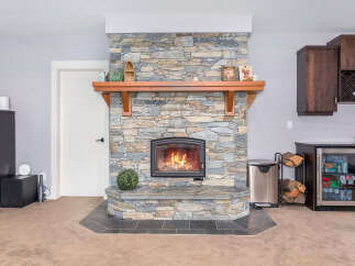 This stunning property boasts a beautiful stone fireplace, perfect for cozy evenings.