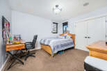This inviting bedroom features a comfortable bed, perfect for relaxation.