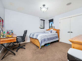 This inviting bedroom features a comfortable bed, perfect for relaxation.