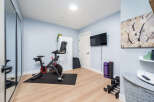 This home gym offers a dedicated space for fitness enthusiasts.