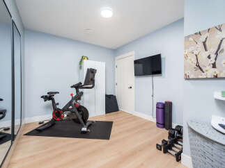 This home gym offers a dedicated space for fitness enthusiasts.