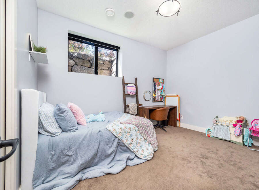 This charming bedroom offers a cozy retreat with its soft color palette and inviting ambiance.