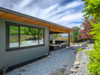 Discover the epitome of outdoor living with this stunning property, featuring a covered patio perfect for relaxation and entertaining.