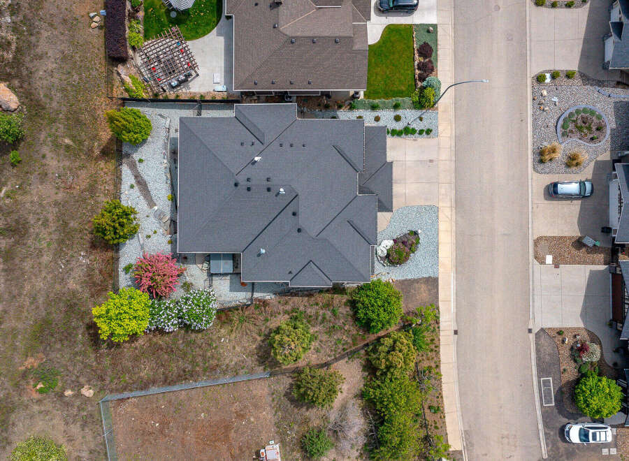 Discover this stunning property featuring a beautifully designed home with a modern roof and well-maintained landscaping.