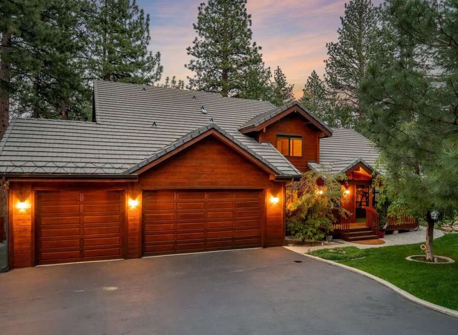 This stunning property boasts a beautiful wooden exterior and a charming design.