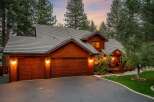 This stunning property boasts a beautiful wooden exterior and a charming design.