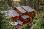 Nestled in a serene, wooded setting, this stunning property boasts a luxurious hot tub, perfect for relaxation.