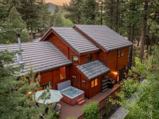 Nestled in a serene, wooded setting, this stunning property boasts a luxurious hot tub, perfect for relaxation.