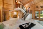 Step into luxury with this stunning home featuring a grand staircase and exquisite wooden accents throughout.