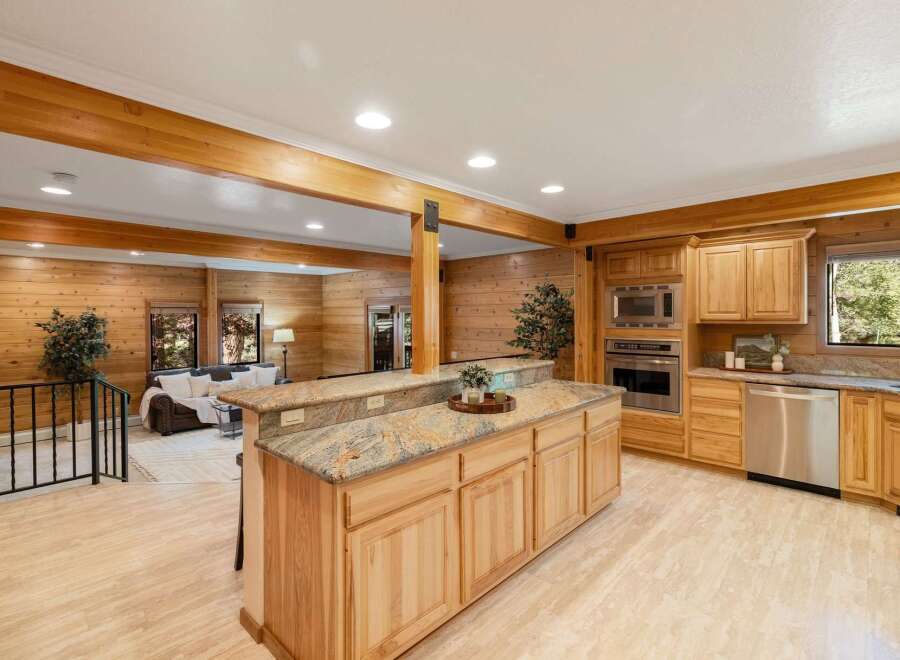 Step into this stunning kitchen with beautiful wood cabinetry and granite countertops.