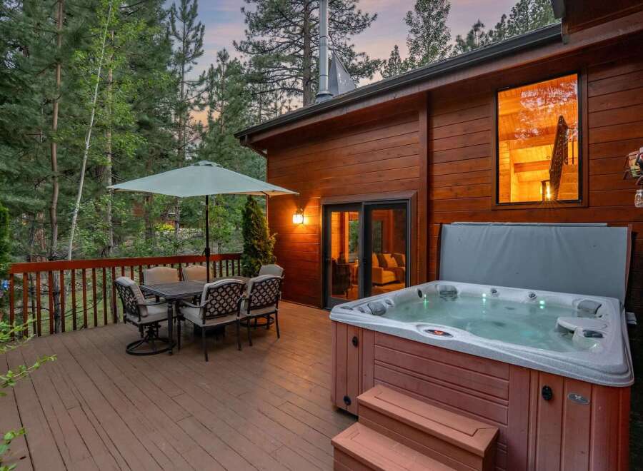 Relax and unwind in this stunning property featuring a luxurious hot tub, perfect for enjoying the serene surroundings.