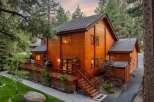 This stunning wooden cabin offers a serene retreat nestled in a picturesque natural setting.