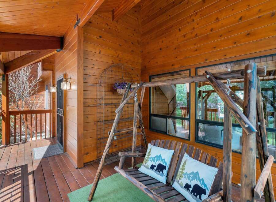 Enjoy the tranquility of this charming cabin with a welcoming porch.