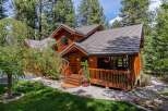 Nestled amidst lush greenery, this stunning wooden home offers a serene retreat.