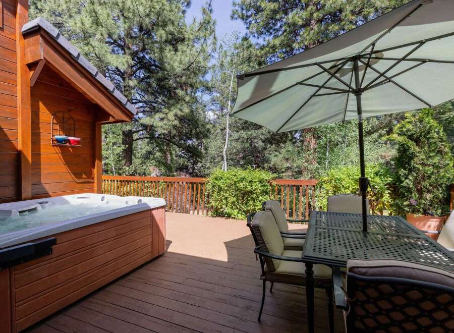 Enjoy the ultimate relaxation in this stunning outdoor oasis! This property features a luxurious hot tub, perfect for unwinding after a long day.