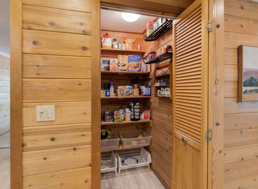 Step into the heart of the home with this charming pantry, a perfect blend of functionality and rustic design.