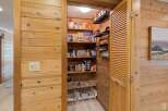 Step into the heart of the home with this charming pantry, a perfect blend of functionality and rustic design.