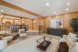 Step into this inviting living space, featuring stunning wood paneling that exudes warmth and character.