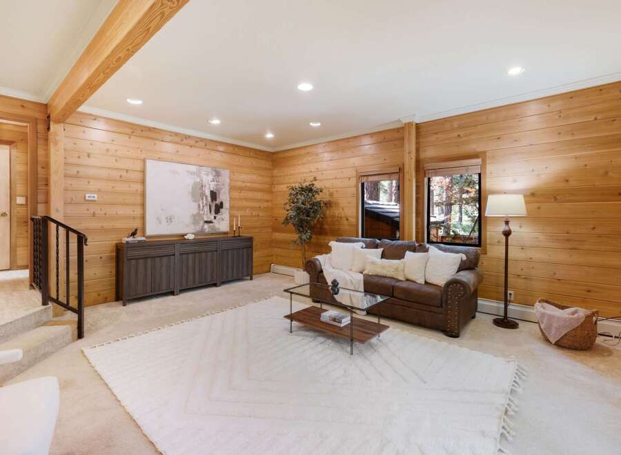 This stunning property boasts a warm and inviting living space, perfect for relaxation and entertaining.