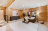 This stunning property boasts a warm and inviting living space, perfect for relaxation and entertaining.