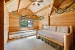 This cozy bedroom features a rustic wooden interior, creating a warm and inviting atmosphere.