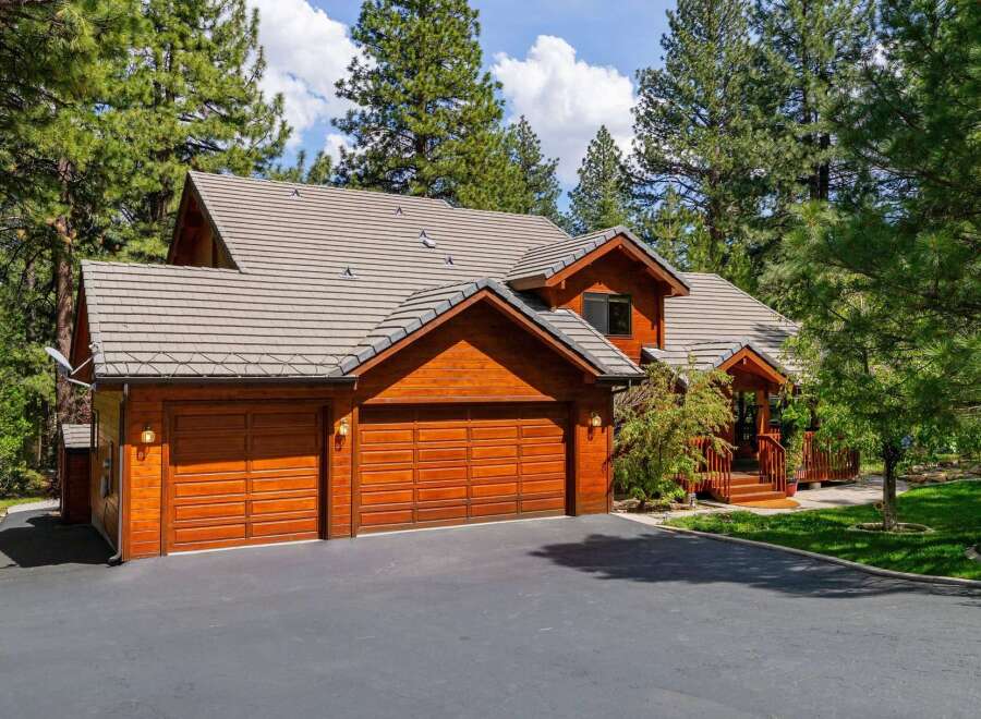 This stunning property boasts a beautiful wooden exterior and a charming design.