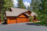 This stunning property boasts a beautiful wooden exterior and a charming design.