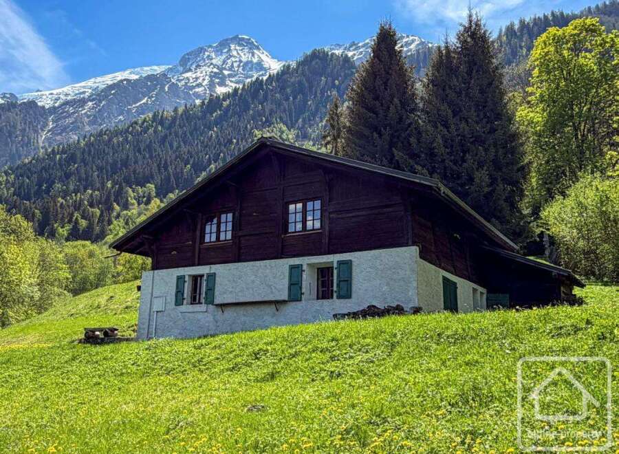 Nestled in a picturesque mountain setting, this charming chalet offers a tranquil escape.