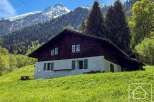 Nestled in a picturesque mountain setting, this charming chalet offers a tranquil escape.
