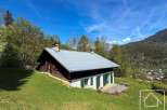 Discover a charming alpine property nestled in a picturesque setting.