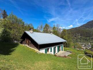 Discover a charming alpine property nestled in a picturesque setting.