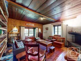 Step into a cozy living space with rustic charm.