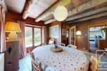 Step into this charming dining room, featuring a rustic wooden interior and a cozy ambiance.
