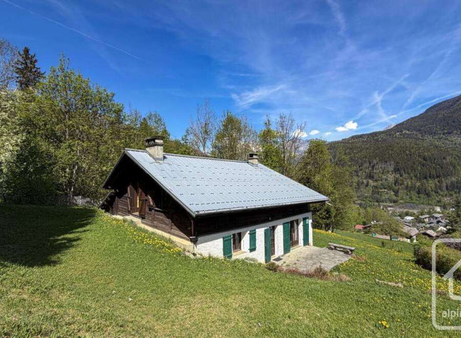 Discover a charming alpine property nestled in a picturesque mountain setting.