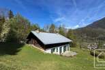 Discover a charming alpine property nestled in a picturesque mountain setting.