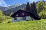 Nestled in a picturesque mountain setting, this charming property offers a tranquil escape.